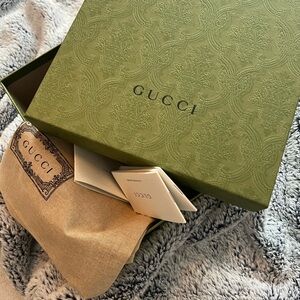 Gucci gift box with dust bag.